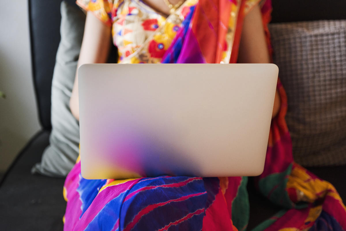 Woman in Saree on a Laptop